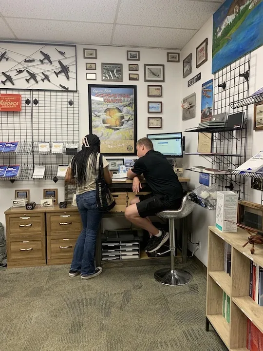 A student reviewing checkride study material with a Certified Flight Instructor